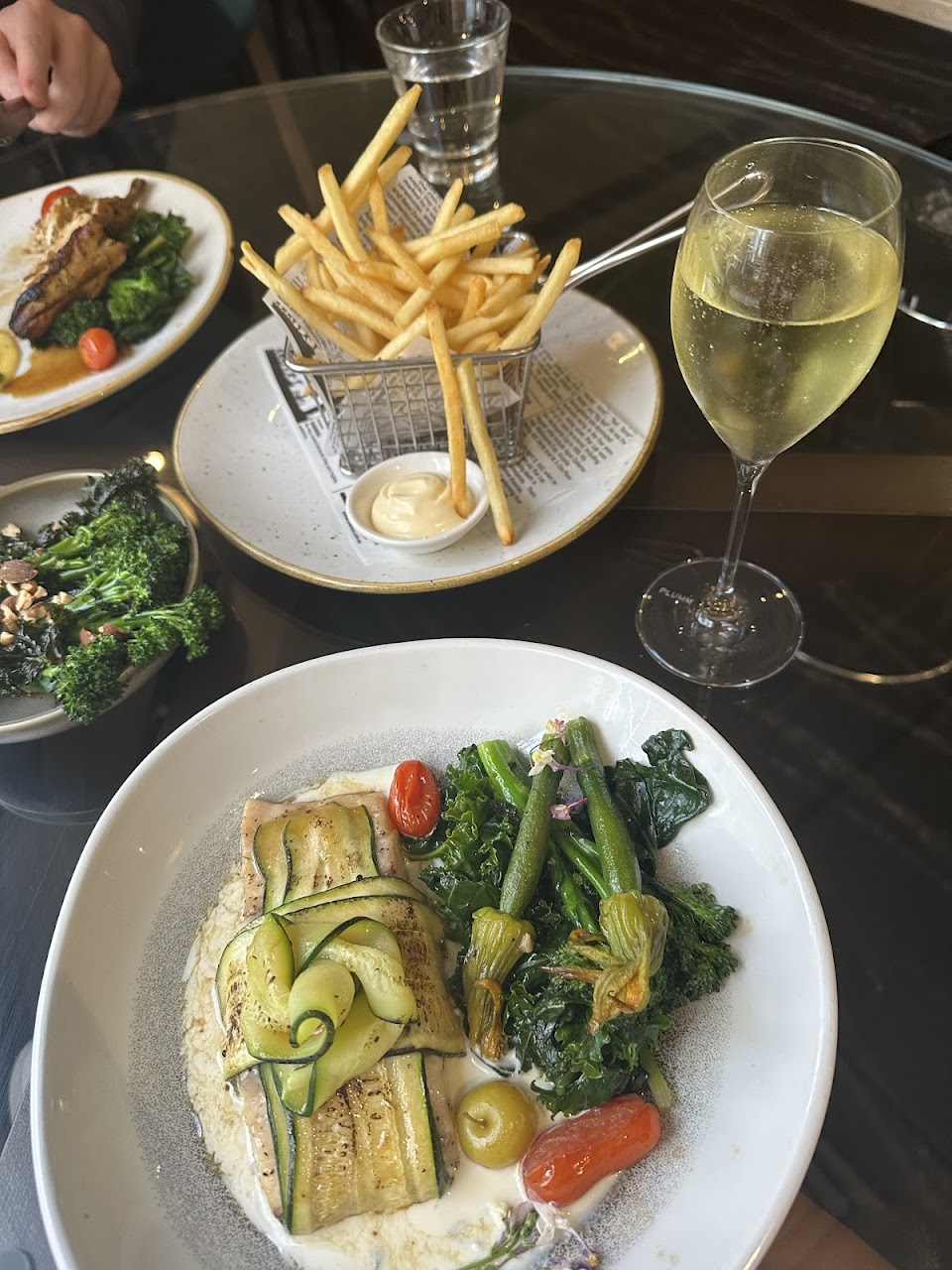 Vegetable dish, frites and a glass of wine at Quartier Bistro & Bar