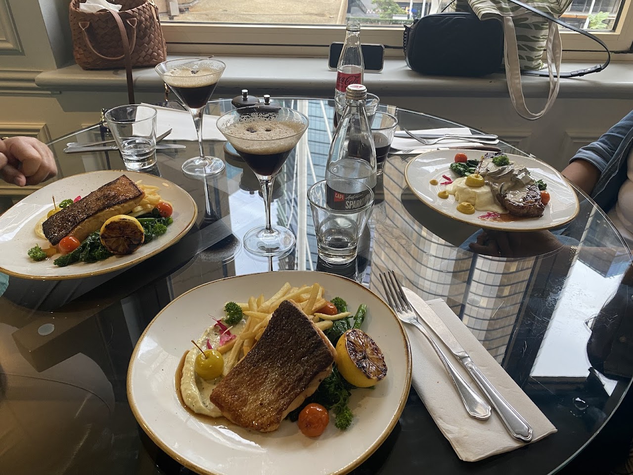 Lunch table with fish plates and cocktails